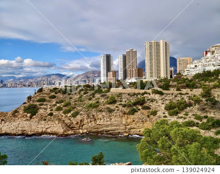 Modern Urban Structures Contrasting Vividly With Untouched Coastal Terrain Creating Vibrant Waterfront Scenery Modern Urban Structures Contrasting Vividly With Untouched Coastal Terrain Creating Vibrant Waterfront Scenery 139024924