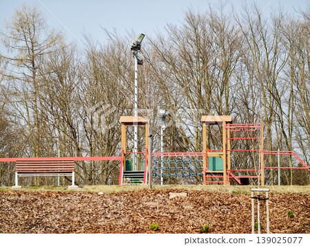 Serene Abandoned Playground. Silent Recreational Space With Antique Structures Surrounded By Fall Leaves Serene Abandoned Playground. Silent Recreational Space With Antique Structures Surrounded By Fall Leaves 139025077