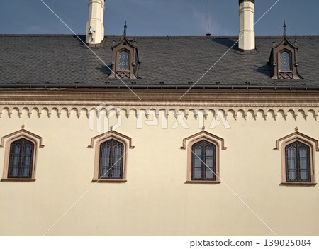 Bright Historic Facade. Heritage Building Featuring Arched Windows And Careful Restoration In Daylight Bright Historic Facade. Heritage Building Featuring Arched Windows And Careful Restoration In Daylight 139025084