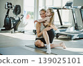 Mother and daughter spending quality time together at home with joy, affection, and emotional bonding 139025101