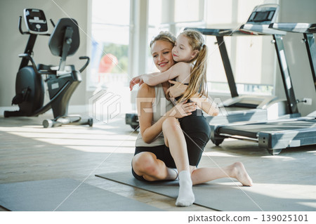 Mother and daughter spending quality time together at home with joy, affection, and emotional bonding 139025101