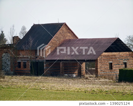 Old Brick Farmstead With Textures. Decayed Brick Country House With Rusted Roof And Weathered Surroundings Old Brick Farmstead With Textures. Decayed Brick Country House With Rusted Roof And Weathered Surroundings 139025124