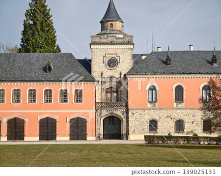 Majestic Gate With Clocktower. Spectacular Gateway Featuring Elaborate Clocktower And Decorative Wings Majestic Gate With Clocktower. Spectacular Gateway Featuring Elaborate Clocktower And Decorative Wings 139025131