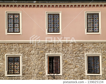 Mediterranean Style Building. Scenic Mediterranean Exterior With Classic Textured Accents And Shutters 139025134