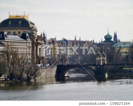 Beautiful Bridge With Statues. Picturesque Riverside View Showcasing Historic Monuments And Reflections Beautiful Bridge With Statues. Picturesque Riverside View Showcasing Historic Monuments And Reflections 139025164