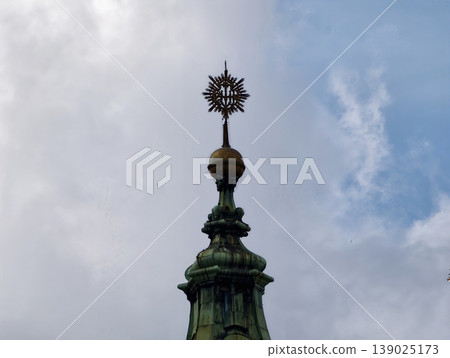 Ornate Metalwork With Patina. Artistic Copper Crowning Piece With Star And Verdigris Details Ornate Metalwork With Patina. Artistic Copper Crowning Piece With Star And Verdigris Details 139025173