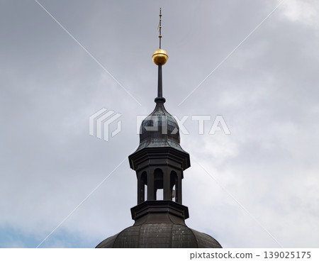 Ancient Golden Roof. Aged Circular Dome Featuring Bright Gold Sphere Beneath Cloudy Sky Background Ancient Golden Roof. Aged Circular Dome Featuring Bright Gold Sphere Beneath Cloudy Sky Background 139025175