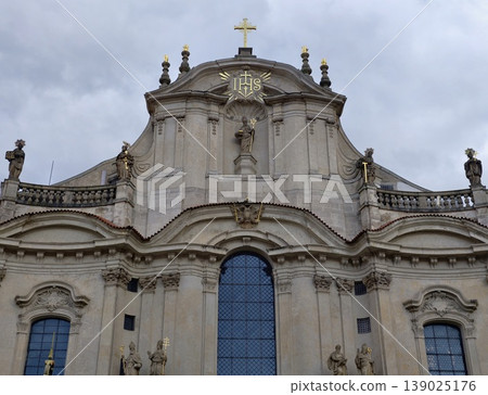 Baroque Style Church With Ornate Decorations. Facade Of Old Church With Sculptures And Architecture Baroque Style Church With Ornate Decorations. Facade Of Old Church With Sculptures And Architecture 139025176