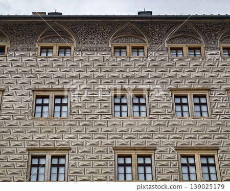 Architectural Facade With Windows. Facade Showcasing Geometric Relief And Rhythmic Window Placement 139025179