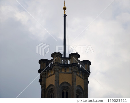 Detailed Spire Highlighted By Decorative Features And Atmospheric Sky For Architectural Showcases 139025511