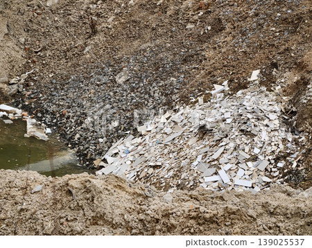 Postmining Landscape With Debris. Former Mining Zone Filled With Rubble And Muted Earth Colors Postmining Landscape With Debris. Former Mining Zone Filled With Rubble And Muted Earth Colors 139025537