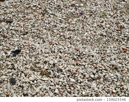 Pebbles With Debris. Detailed View Of Tiny Sandcolored Stones Mixed With Plastic Pieces And Colorful Waste 139025546