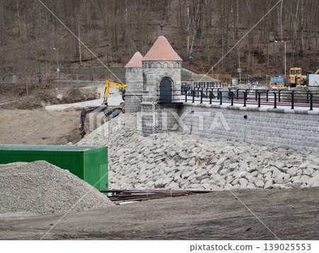 Dam Construction Progressing. Construction Site With Machinery Improving Flood Defenses And Infrastructure Dam Construction Progressing. Construction Site With Machinery Improving Flood Defenses And Infrastructure 139025553