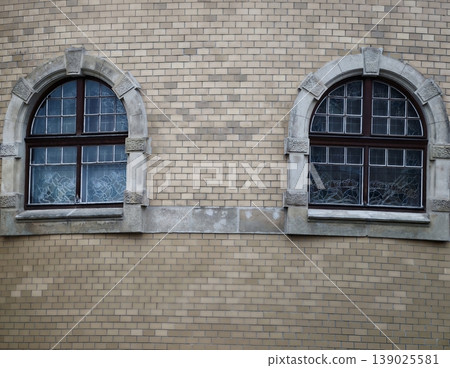 Photograph Of Traditional Arched Windows Emphasizing Timeless Materials And Harmonious Proportions Photograph Of Traditional Arched Windows Emphasizing Timeless Materials And Harmonious Proportions 139025581