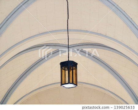 Photographic Scene Of Hanging Lantern With Symmetrical Arches And Visible Cracks In Plaster Ribs Photographic Scene Of Hanging Lantern With Symmetrical Arches And Visible Cracks In Plaster Ribs 139025633