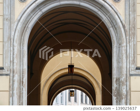 Historic Building With Arched Windows And Intricate Stone Carvings Displaying Craftsmanship 139025637