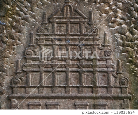 Richly Detailed Carved Stone Surface Showing Signs Of Weathering And Historical Craftsmanship Richly Detailed Carved Stone Surface Showing Signs Of Weathering And Historical Craftsmanship 139025654