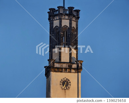 Architectural Monument In City Center Displays Clock Face And Celebrates Civic Festivities Enthusiastically Architectural Monument In City Center Displays Clock Face And Celebrates Civic Festivities Enthusiastically 139025658