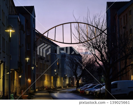 Evening Urban Scene. Tranquil Urban Setting During Twilight With Soft Colors And Glowing Streetlights Evening Urban Scene. Tranquil Urban Setting During Twilight With Soft Colors And Glowing Streetlights 139025661