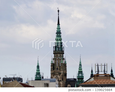 Green Spires And Copper Accents. Heritage Monument With Verdigris Details And Ceremonial Silhouette Green Spires And Copper Accents. Heritage Monument With Verdigris Details And Ceremonial Silhouette 139025664