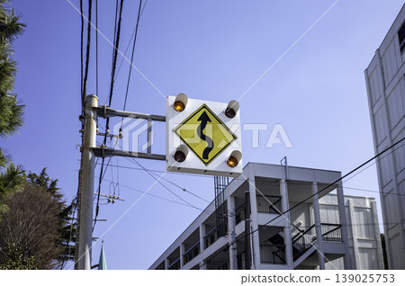 Road sign "Left zigzag ahead" Sharp curve Road sign "Left zigzag ahead" Sharp curve 139025753