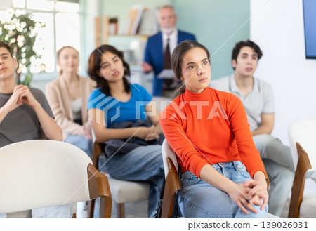 Female student listens attentively to a lecture 139026031