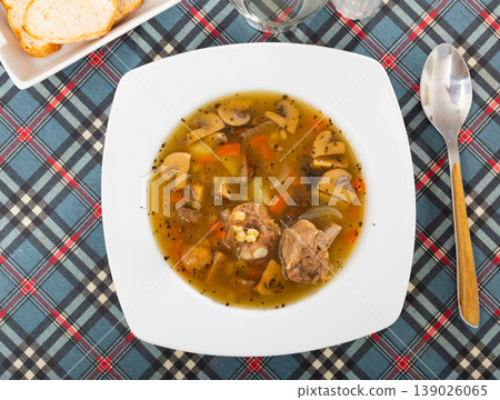 Pork and mushroom soup with vegetables and pearl barley Pork and mushroom soup with vegetables and pearl barley 139026065