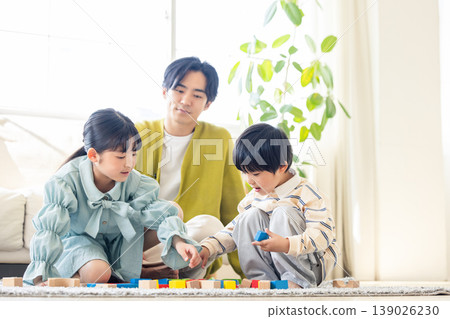 A family relaxing in the living room 139026230