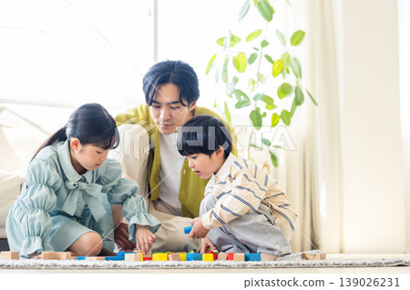 A family relaxing in the living room A family relaxing in the living room 139026231