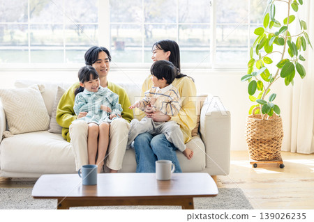 A family relaxing in the living room 139026235