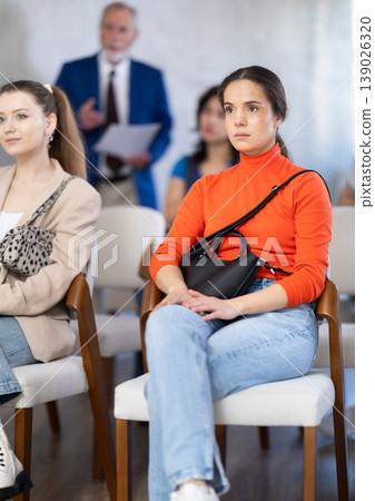Female student listens attentively to a lecture Female student listens attentively to a lecture 139026320