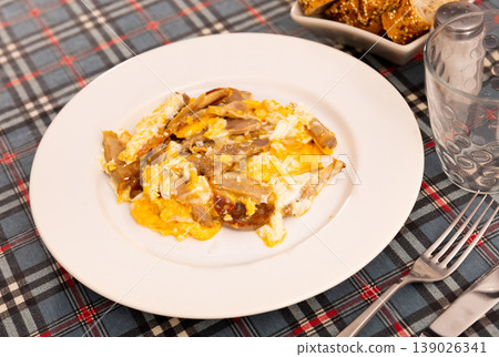 Close up of grilled bacon and egg served on white plate Close up of grilled bacon and egg served on white plate 139026341