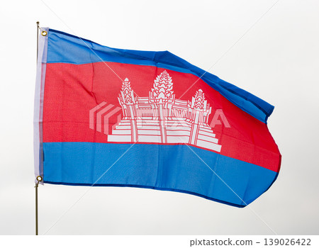 National flag of Cambodia waving on flagstaff against sky National flag of Cambodia waving on flagstaff against sky 139026422