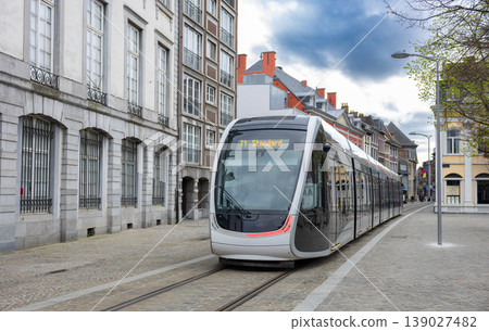 Modern tram in european city street urban transport mobility and infrastructure concept Modern tram in european city street urban transport mobility and infrastructure concept 139027482