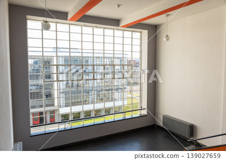 Large industrial window with grid frame interior view modern architecture natural light Large industrial window with grid frame interior view modern architecture natural light 139027659