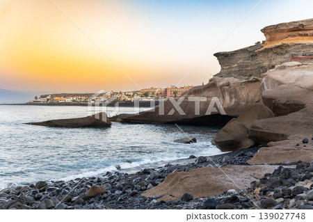 Rocky Coastal Cliff Formation At Sunset With Ocean Horizon Landscape View Rocky Coastal Cliff Formation At Sunset With Ocean Horizon Landscape View 139027748