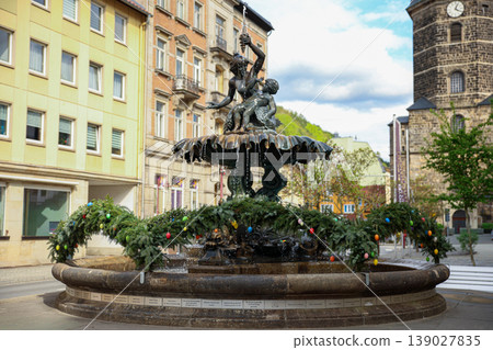 Historic City Fountain with Sculpture and Urban Architecture Daylight Travel Scene Historic City Fountain with Sculpture and Urban Architecture Daylight Travel Scene 139027835