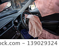 Deployed Airbags Inside Car Interior After Accident showing Steering Wheel and Dashboard 139029324