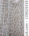 Snow Tire Track Pattern on Icy Ground Winter Texture Background 139029338