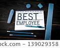 Best Employee Text on Notebook With Office Supplies 139029358