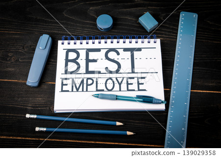 Best Employee Text on Notebook With Office Supplies 139029358