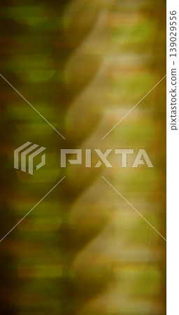 Defocused art light. Lens glow. Yellow green prism pattern flow effect luminosity. Golden warm color abstract kaleidoscopic background. Defocused art light. Lens glow. Yellow green prism pattern flow effect luminosity. Golden warm color abstract kaleidoscopic background. 139029556