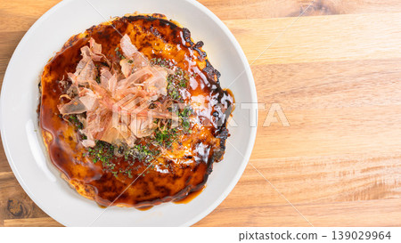 Okonomiyaki: Kansai-style okonomiyaki topped with bonito flakes and sauce. Okonomiyaki: Kansai-style okonomiyaki topped with bonito flakes and sauce. 139029964