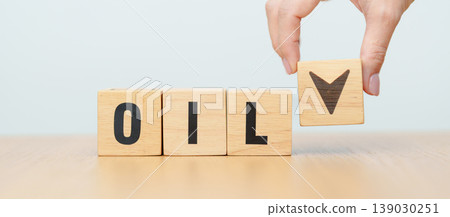 Hand change wooden block with OIL text to UP and Down arrow symbol icon. Trade war, stocks, financial, cut loss and economic concept Hand change wooden block with OIL text to UP and Down arrow symbol icon. Trade war, stocks, financial, cut loss and economic concept 139030251