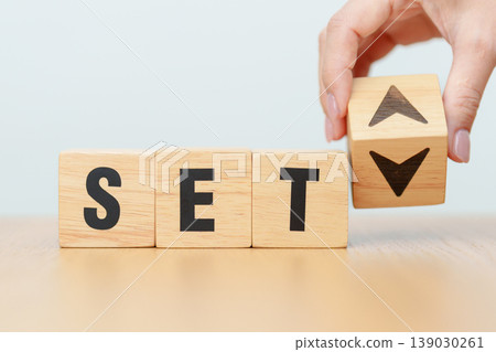 Hand change wooden block with SET text or The Stock Exchange of Thailand to UP and Down arrow symbol icon. decrease and increase, price, stocks, financial, trade, value and Cut loss concept Hand change wooden block with SET text or The Stock Exchange of Thailand to UP and Down arrow symbol icon. decrease and increase, price, stocks, financial, trade, value and Cut loss concept 139030261