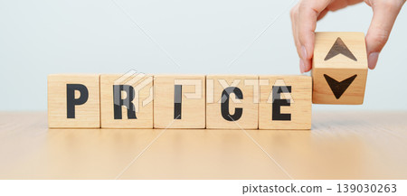 hand change wooden block with PRICE text to UP and Down arrow icon. Sale marketing, Price decrease and Increase Financial, money Value, discount, consumption, investment and purchases concept 139030263