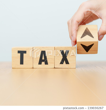 hand change wooden block with TAX text to UP and Down arrow icon. decrease and Increase, Taxpayer, Taxable Income, Tax Filing, Deduction, Withholding Tax, WHT, VAT, Computation and Exemption concept hand change wooden block with TAX text to UP and Down arrow icon. decrease and Increase, Taxpayer, Taxable Income, Tax Filing, Deduction, Withholding Tax, WHT, VAT, Computation and Exemption concept 139030267