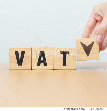 hand change wooden block with VAT text to UP and Down arrow icon. Value Added Tax, decrease and Increase, Taxpayer, Taxable Income, Tax Filing, Deduction, Withholding Tax, Computation and Exemption hand change wooden block with VAT text to UP and Down arrow icon. Value Added Tax, decrease and Increase, Taxpayer, Taxable Income, Tax Filing, Deduction, Withholding Tax, Computation and Exemption 139030268