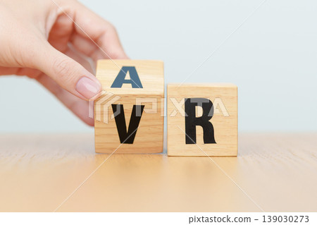 hand change wooden block from VR to AR, VIRTUAL and AUGMENTED REALITY, MR, Mixed Reality, XR, Extended, Metaverse and Immersive Technology concept hand change wooden block from VR to AR, VIRTUAL and AUGMENTED REALITY, MR, Mixed Reality, XR, Extended, Metaverse and Immersive Technology concept 139030273