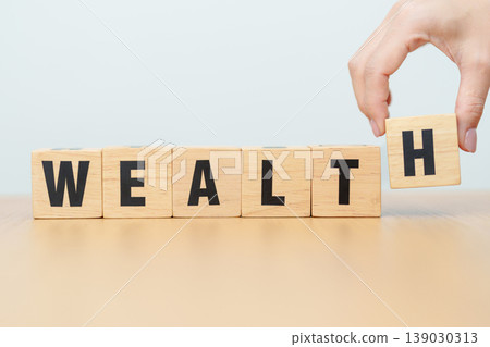 wooden block Wealth. Investment, Healthcare, Insurance, wellness, wellbeing and Work Life Balance concept wooden block Wealth. Investment, Healthcare, Insurance, wellness, wellbeing and Work Life Balance concept 139030313